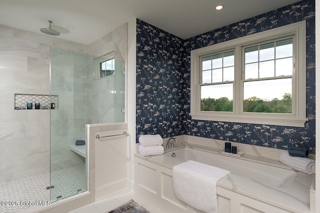 full bath featuring tiled shower, a bath, and wallpapered walls