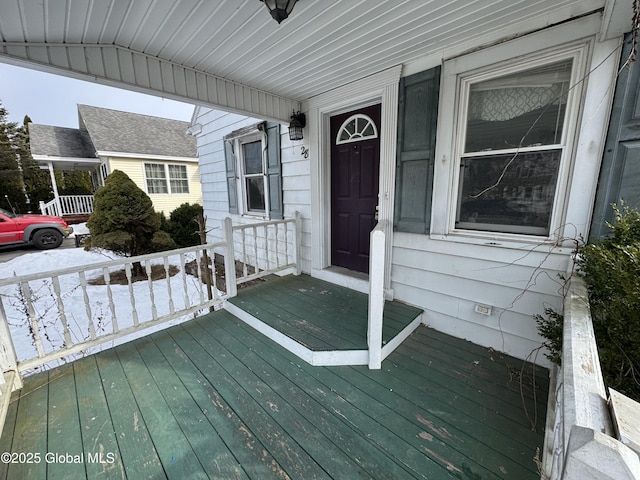 wooden terrace featuring covered porch