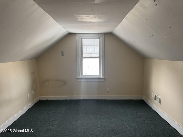 bonus room featuring visible vents, baseboards, lofted ceiling, and carpet