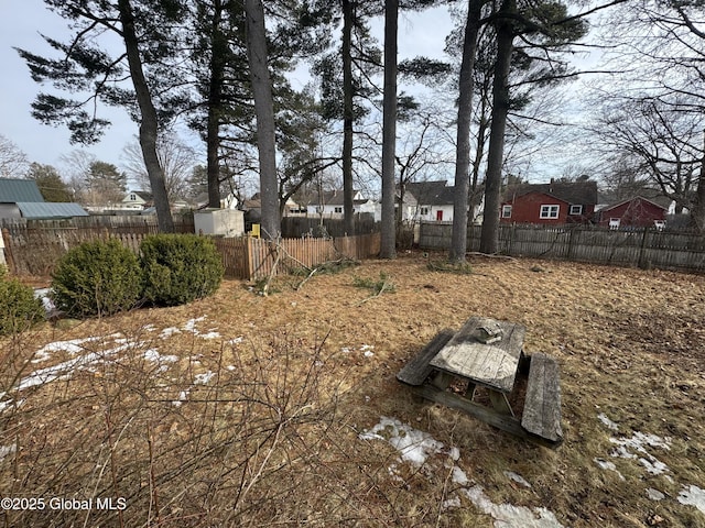 view of yard with an outdoor structure and fence