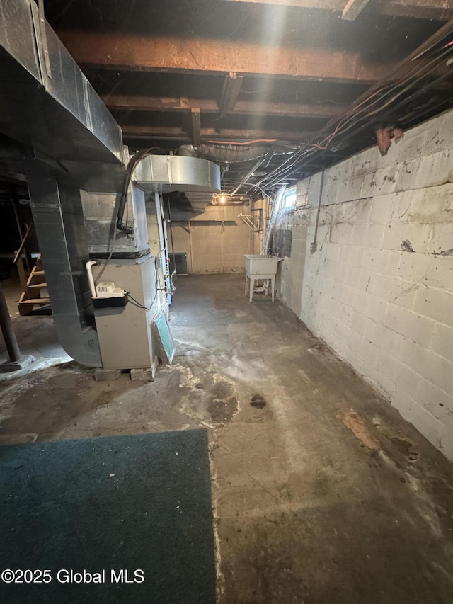 unfinished basement featuring heating unit