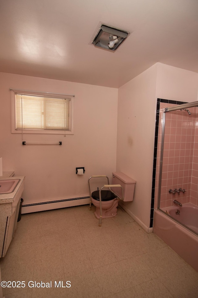 full bathroom with a baseboard radiator, enclosed tub / shower combo, vanity, baseboards, and tile patterned floors