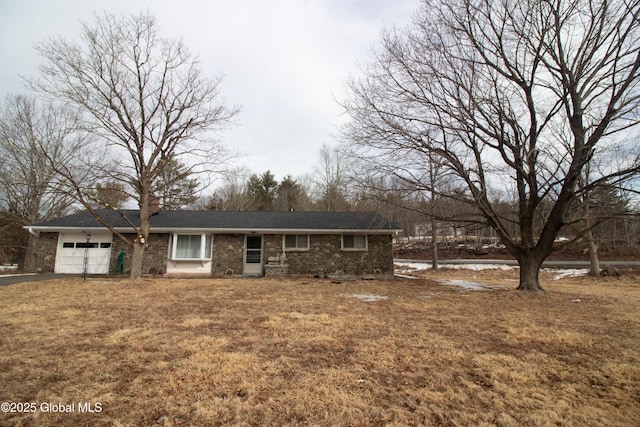 view of front facade with a garage and a front lawn