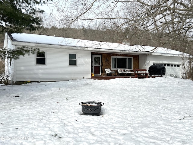 single story home with covered porch and an attached garage