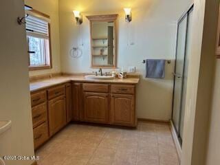 full bathroom with vanity and a shower stall