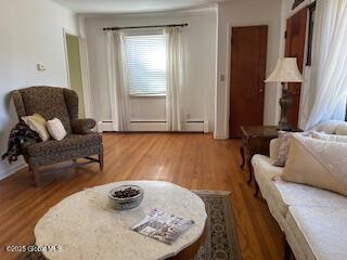 sitting room featuring wood finished floors