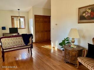 sitting room featuring wood finished floors