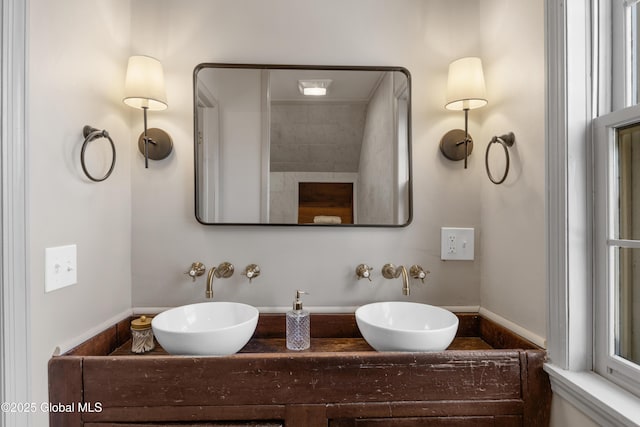 bathroom with double vanity and a sink