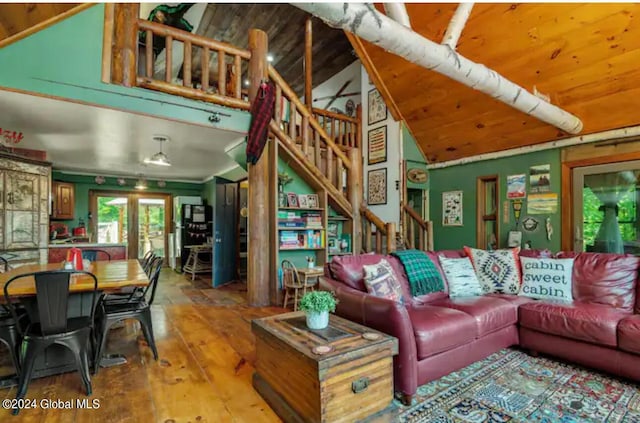 living room with wooden ceiling, wood-type flooring, stairs, and vaulted ceiling