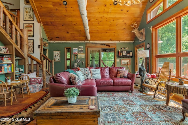 living room with wooden ceiling, stairway, vaulted ceiling, and an inviting chandelier