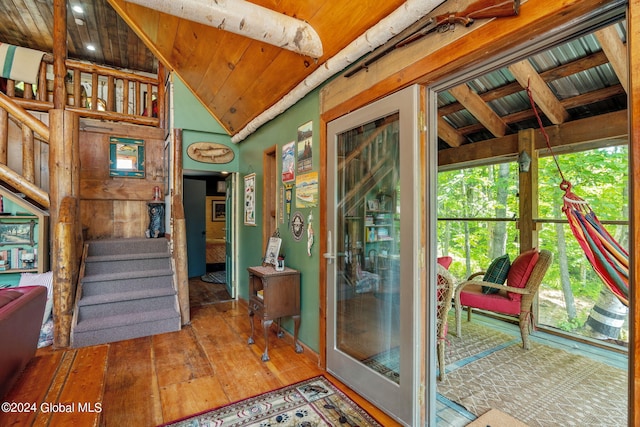 interior space featuring wood ceiling, stairway, vaulted ceiling, and hardwood / wood-style flooring