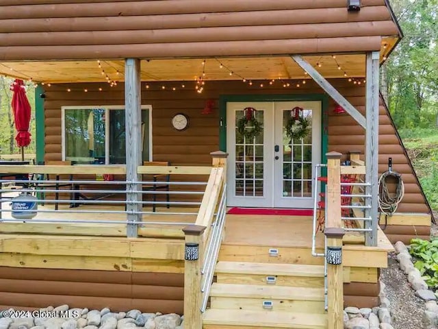 property entrance with french doors and faux log siding