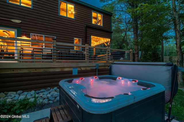 wooden terrace with a hot tub