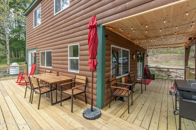 wooden deck with outdoor dining area