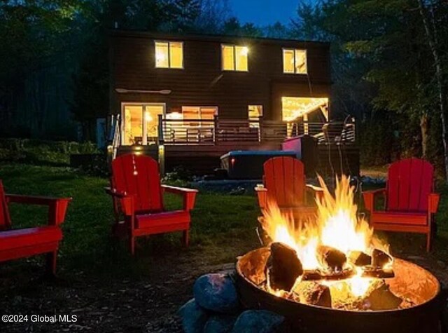 exterior space with a fire pit and a deck