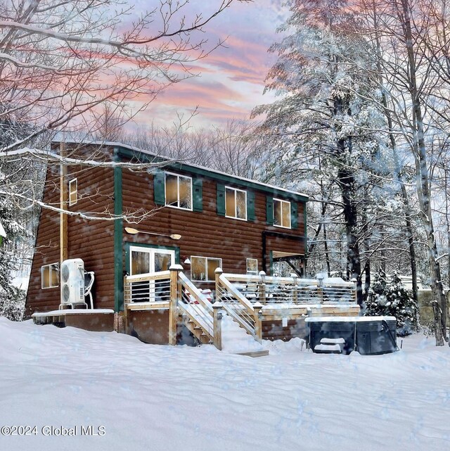 view of front of home with faux log siding