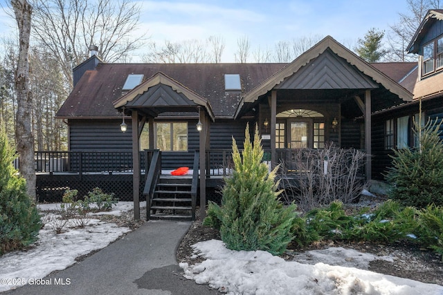 rustic home featuring faux log siding