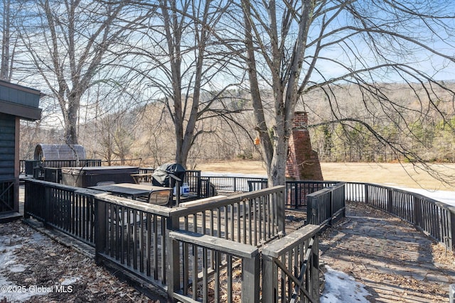 deck featuring a hot tub