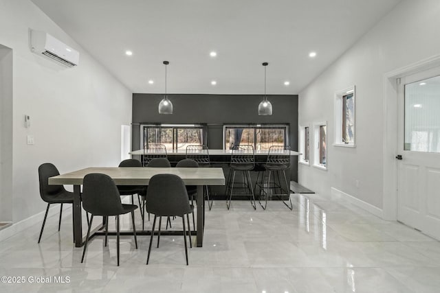 dining area with recessed lighting, marble finish floor, a wall unit AC, and baseboards