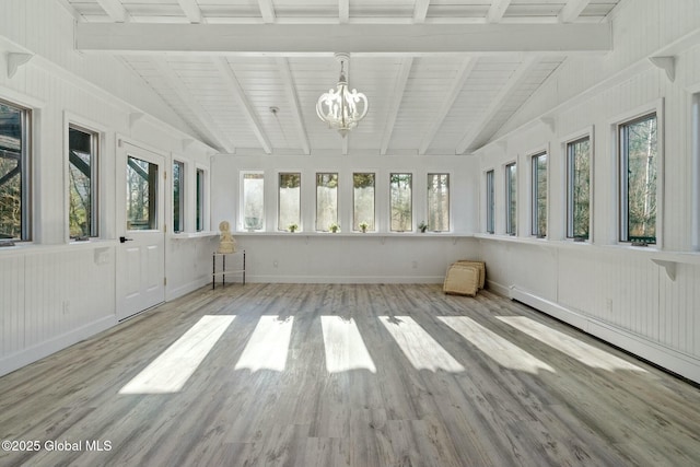 unfurnished sunroom featuring a baseboard radiator, a notable chandelier, and vaulted ceiling with beams