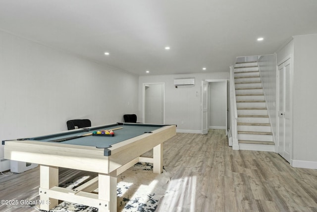 rec room with billiards, a wall mounted AC, wood finished floors, and recessed lighting