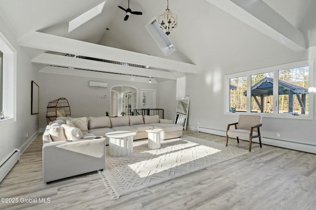 living room featuring arched walkways, wood finished floors, and an inviting chandelier