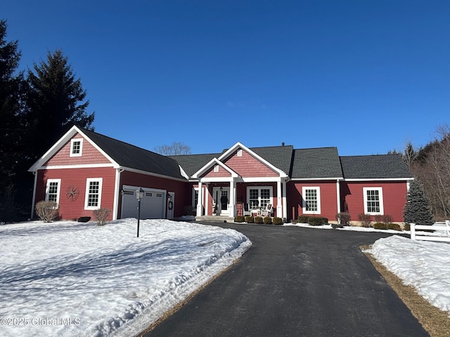 view of front of home with a garage and driveway