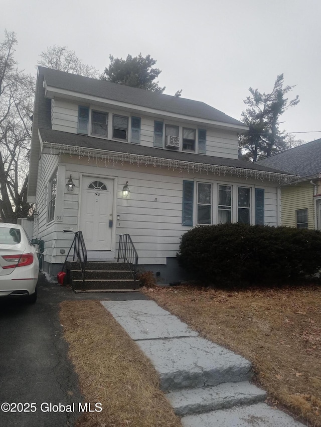 view of front of house featuring cooling unit