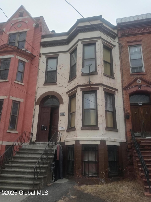 view of property featuring brick siding