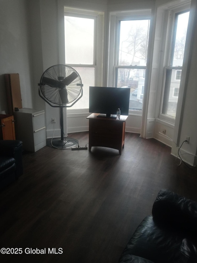 interior space with dark wood-style floors and baseboards