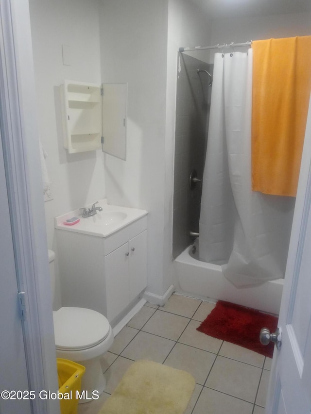 full bathroom with shower / bath combo with shower curtain, toilet, vanity, and tile patterned flooring