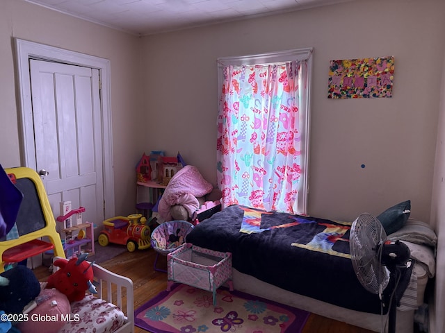 bedroom with wood finished floors