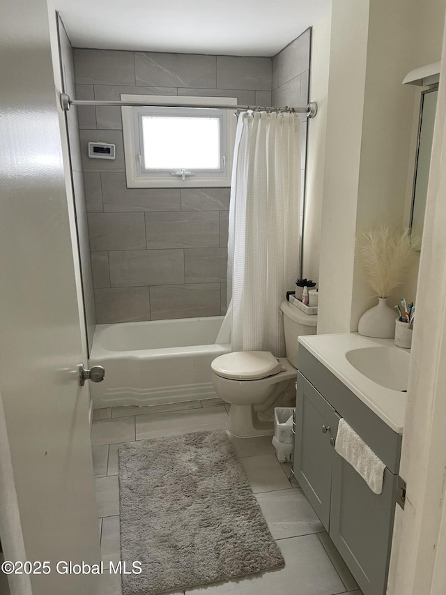 full bathroom with toilet, shower / bath combo with shower curtain, and vanity