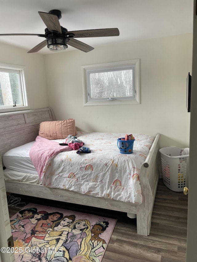 bedroom featuring ceiling fan and wood finished floors