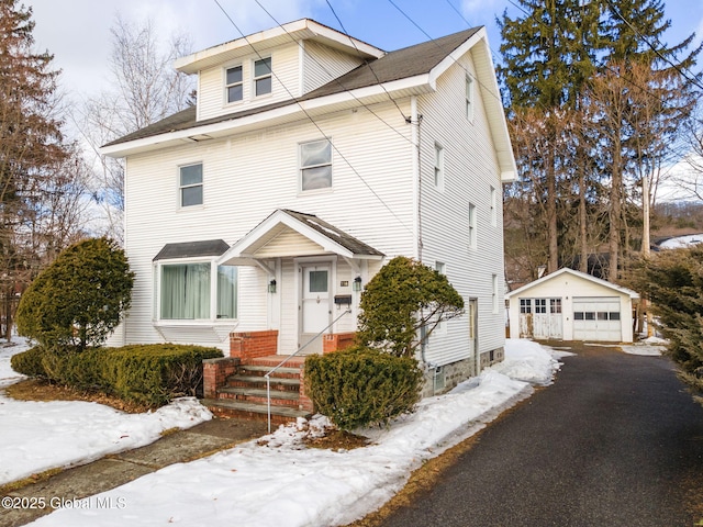 traditional style home with an outbuilding and a detached garage