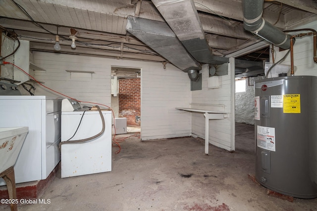 unfinished basement with washer / dryer, water heater, and a sink