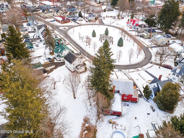 snowy aerial view featuring a residential view