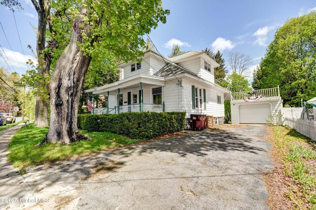 244 Kingsboro Ave, Gloversville, NY 12078 - view of front of property with asphalt driveway, covered porch, and fence