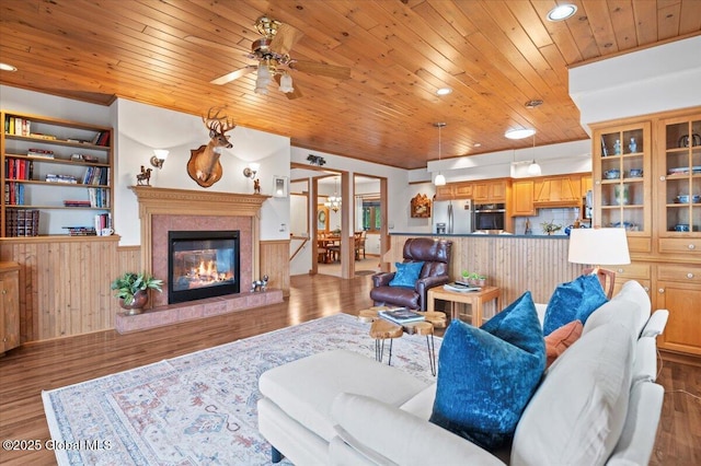 536 E Shore Dr, Horicon, NY 12808 - living area featuring a wainscoted wall, wooden ceiling, recessed lighting, wood finished floors, and a ceiling fan