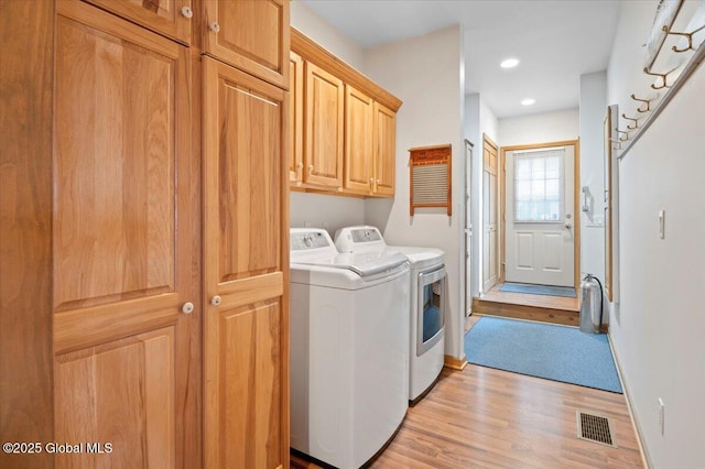 536 E Shore Dr, Horicon, NY 12808 - washroom with cabinet space, washer and dryer, light wood-style floors, baseboards, and recessed lighting
