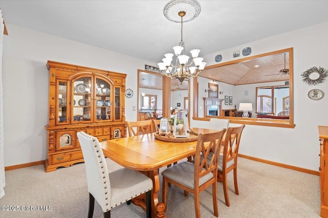 536 E Shore Dr, Horicon, NY 12808 - dining room featuring a chandelier, baseboards, wood ceiling, lofted ceiling, and light colored carpet