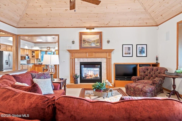 536 E Shore Dr, Horicon, NY 12808 - living room with crown molding, ceiling fan, wooden ceiling, and a tiled fireplace