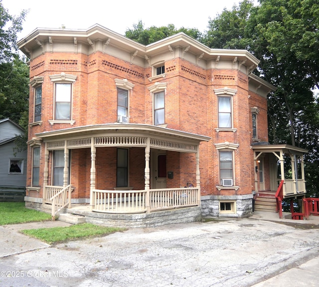 44 Cliff St, Canajoharie Village, NY 13317 - italianate house featuring brick siding and a porch