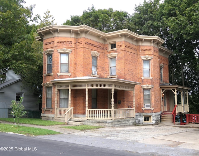 44 Cliff St, Canajoharie Village, NY 13317 - italianate-style house with a porch and brick siding