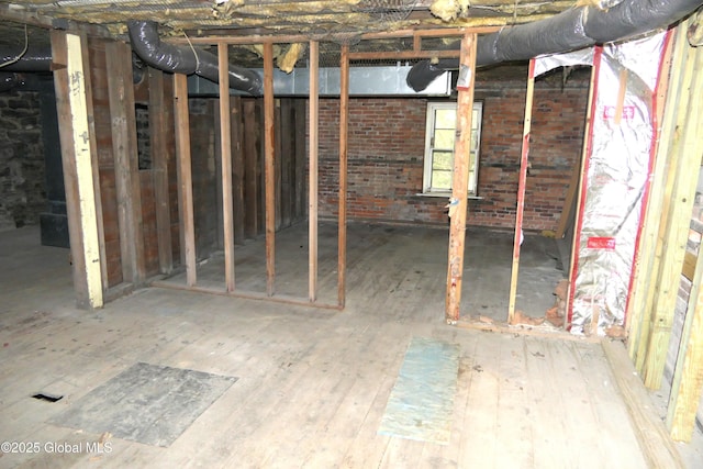 44 Cliff St, Canajoharie Village, NY 13317 - interior space with brick wall and hardwood / wood-style flooring