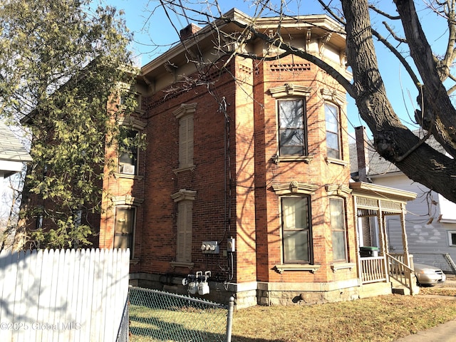 44 Cliff St, Canajoharie Village, NY 13317 - view of front facade featuring fence and brick siding