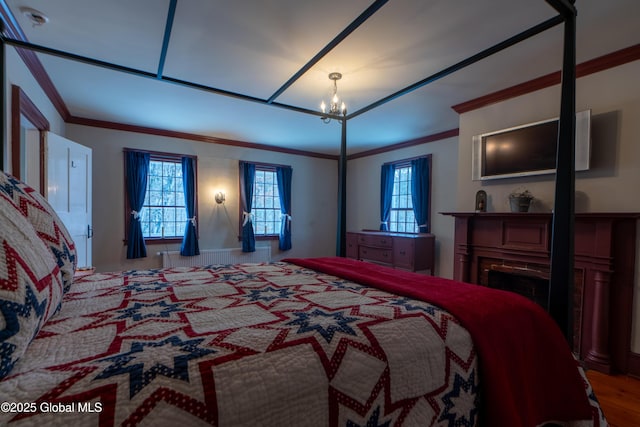 bedroom featuring a notable chandelier, multiple windows, and ornamental molding