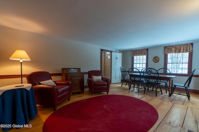 living room featuring baseboards and wood finished floors