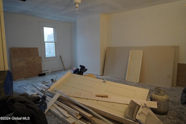 miscellaneous room featuring a baseboard heating unit