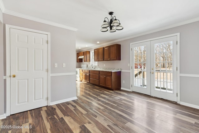 kitchen featuring dark wood-style flooring, french doors, crown molding, electric range oven, and baseboards